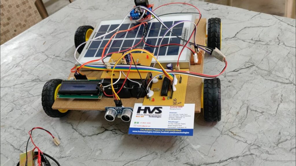 HVS-122. Implementation of a Versatile Solar Powered Vehicle with Ultrasonic sensors which gives voltage display on LCD.