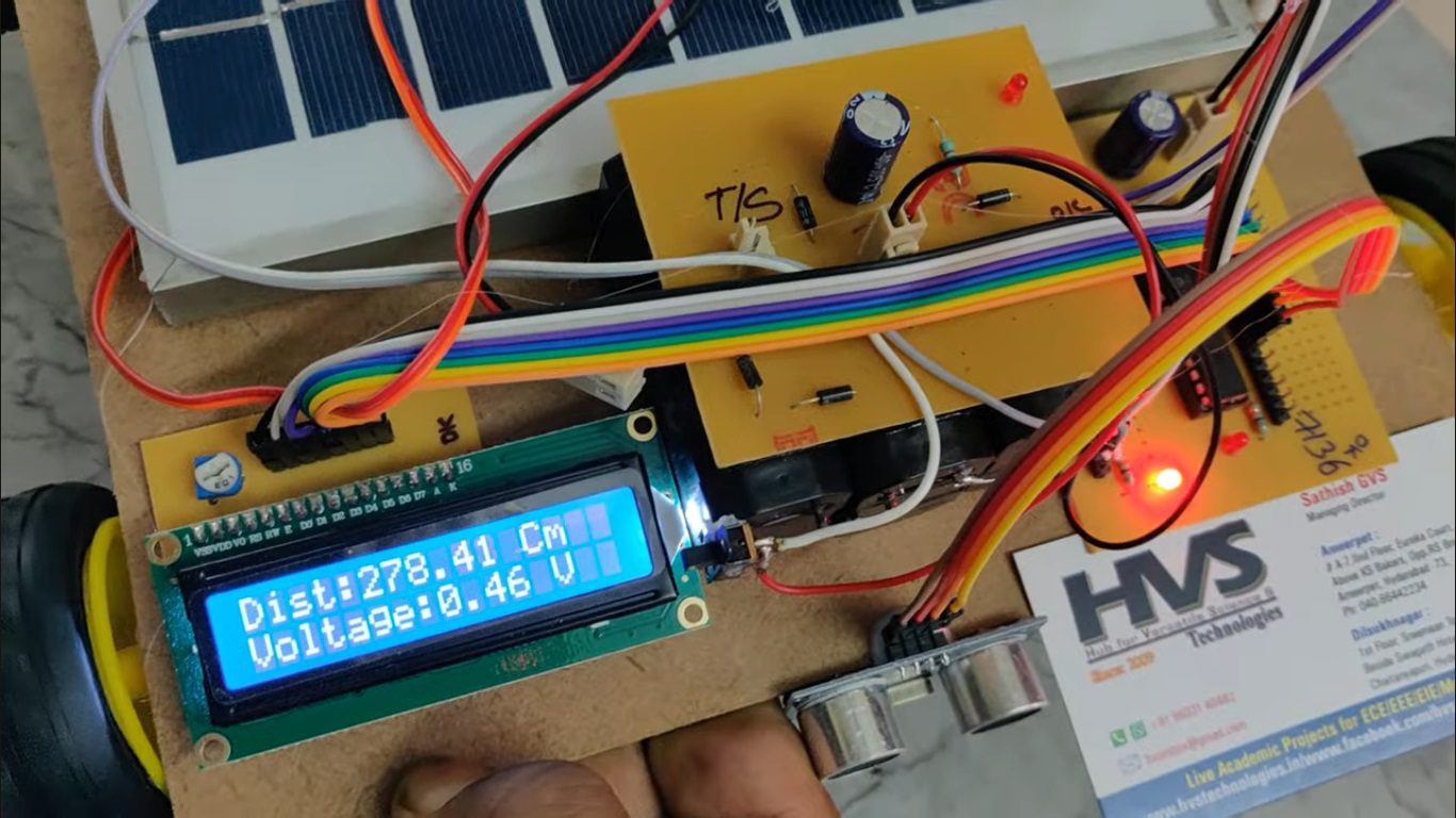 HVS-122. Implementation of a Versatile Solar Powered Vehicle with Ultrasonic sensors which gives voltage display on LCD.