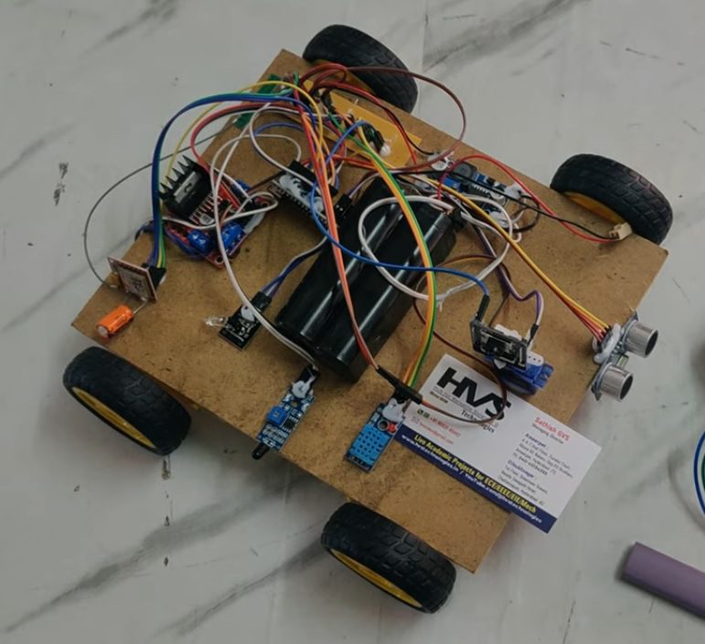 HVS-5053. Surveillance Rover - ESP32-CAM, DHT11, Vibration Sensor, Fire alerts through SMS