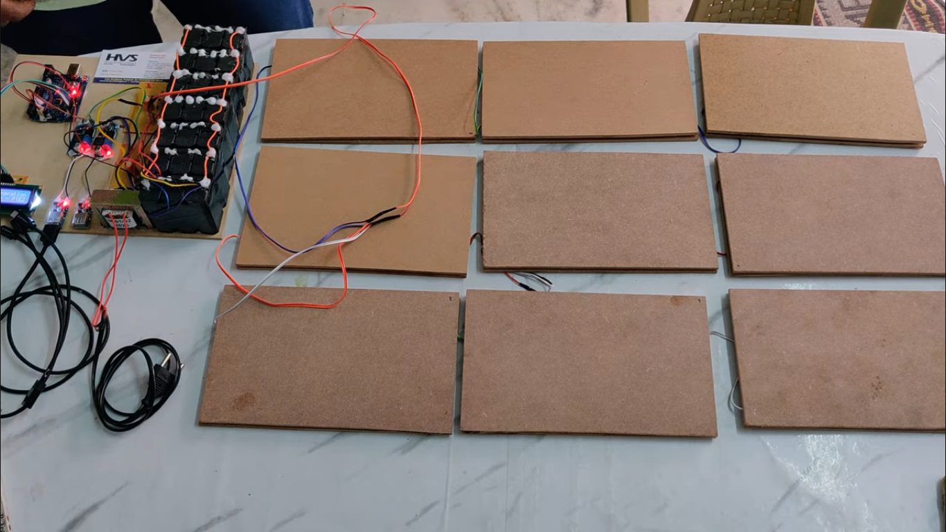 HVS-5025. Foot Step Power generation using Piezoelectric Plates and Mobile charging Station